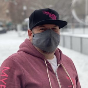 black cap with pink dragon logo
